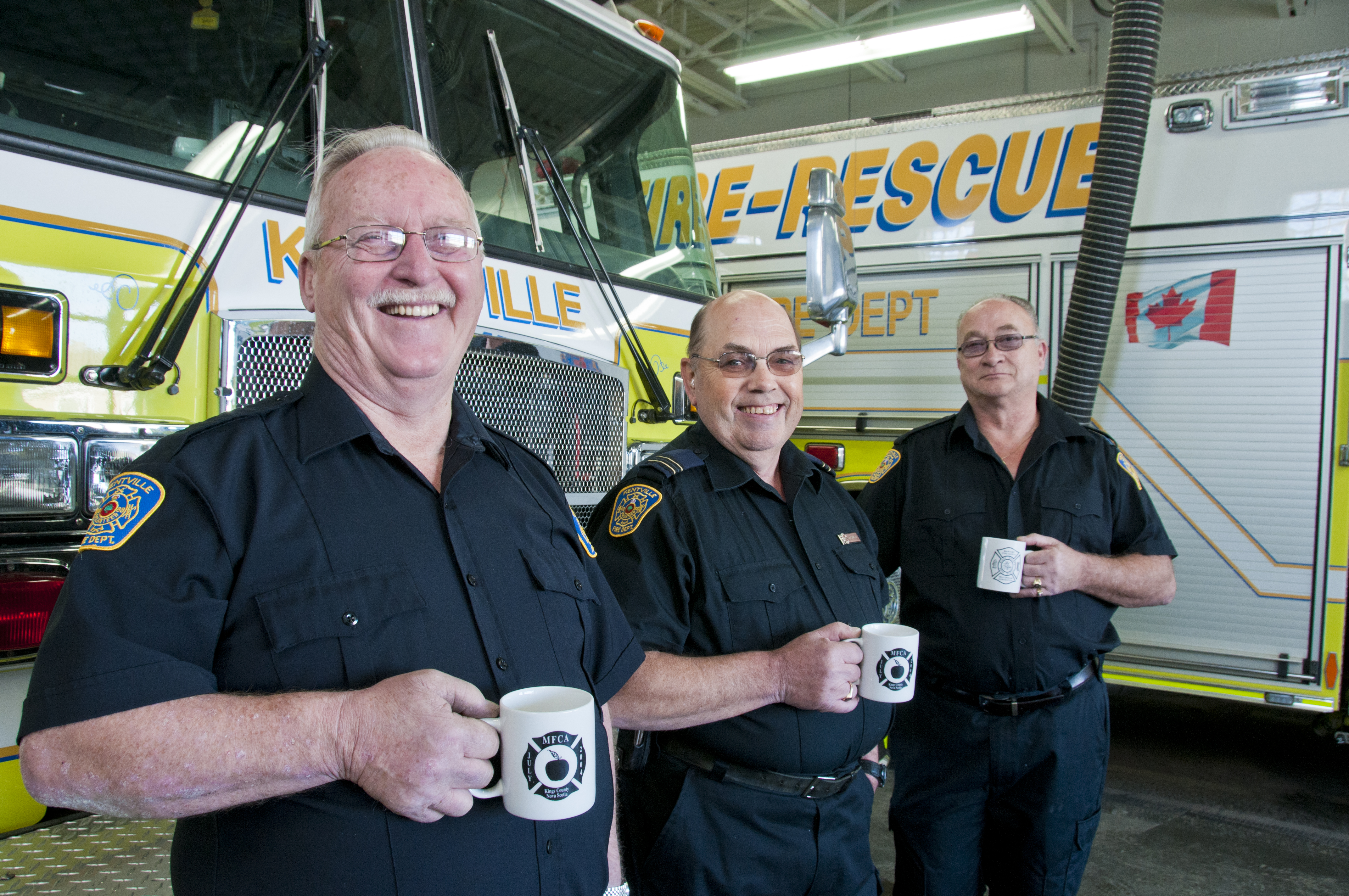 Volunteer firefighters near a truck
